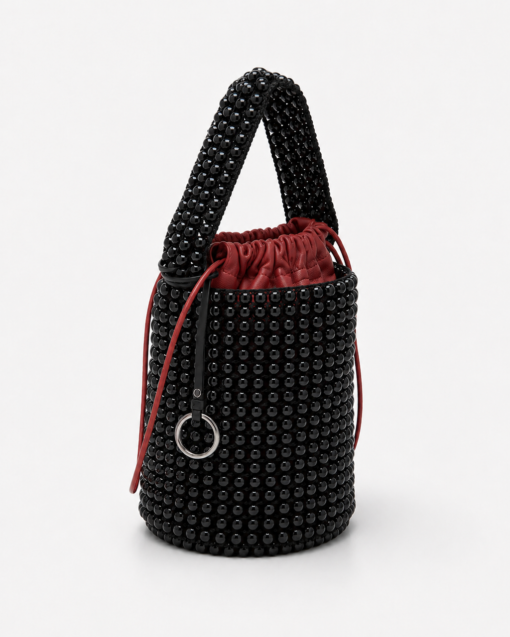 Avant-Garde Beaded Bucket Bag with Contrast Red Leather Drawstring Pouch