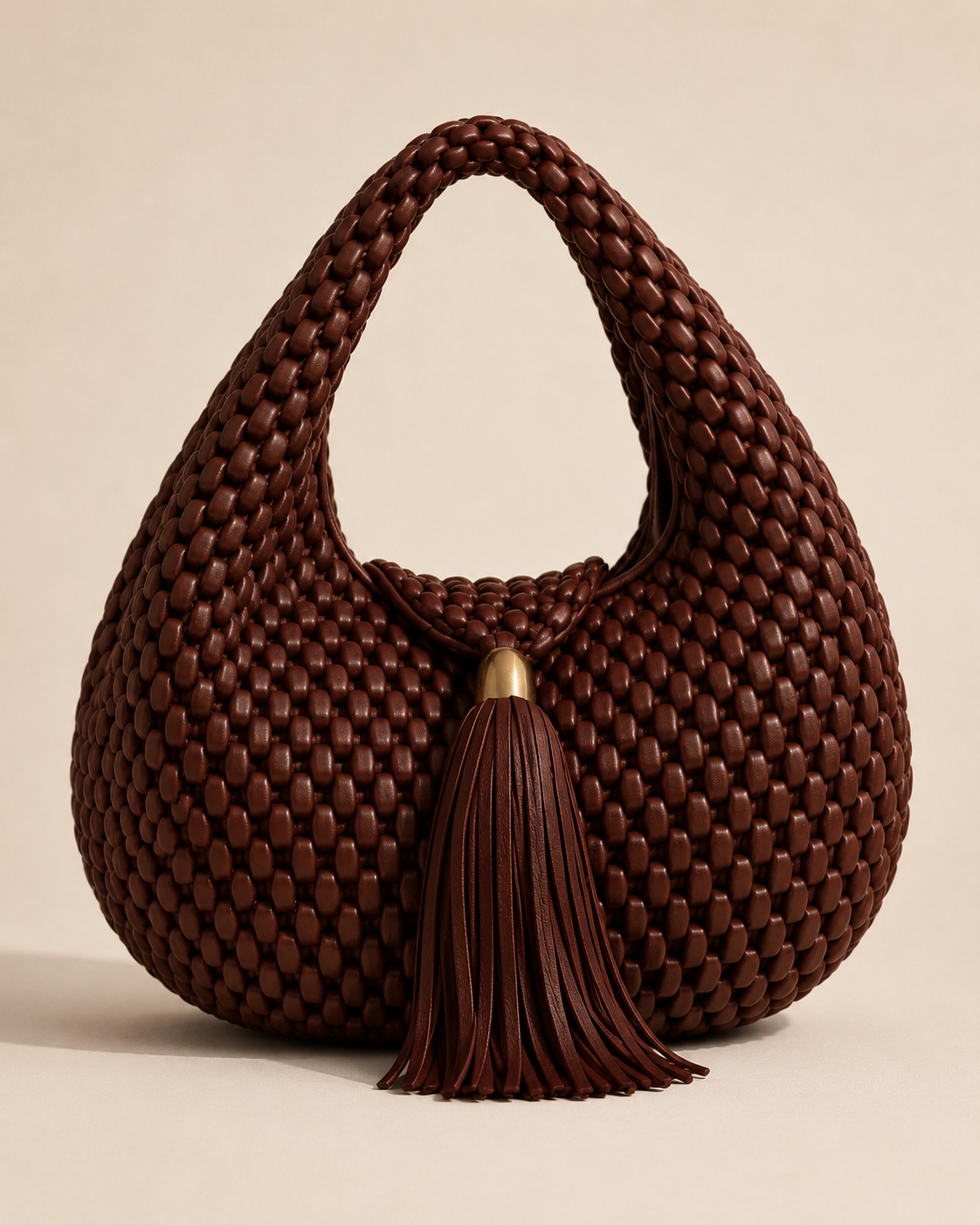 Luxury Woven Leather Hobo Bag with Statement Tassel and Gold Accent