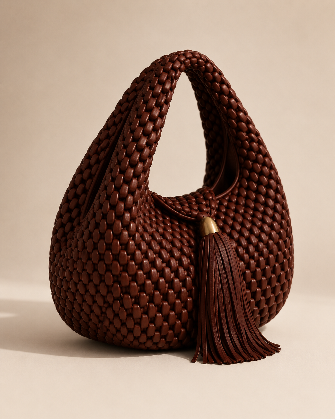 Luxury Woven Leather Hobo Bag with Statement Tassel and Gold Accent