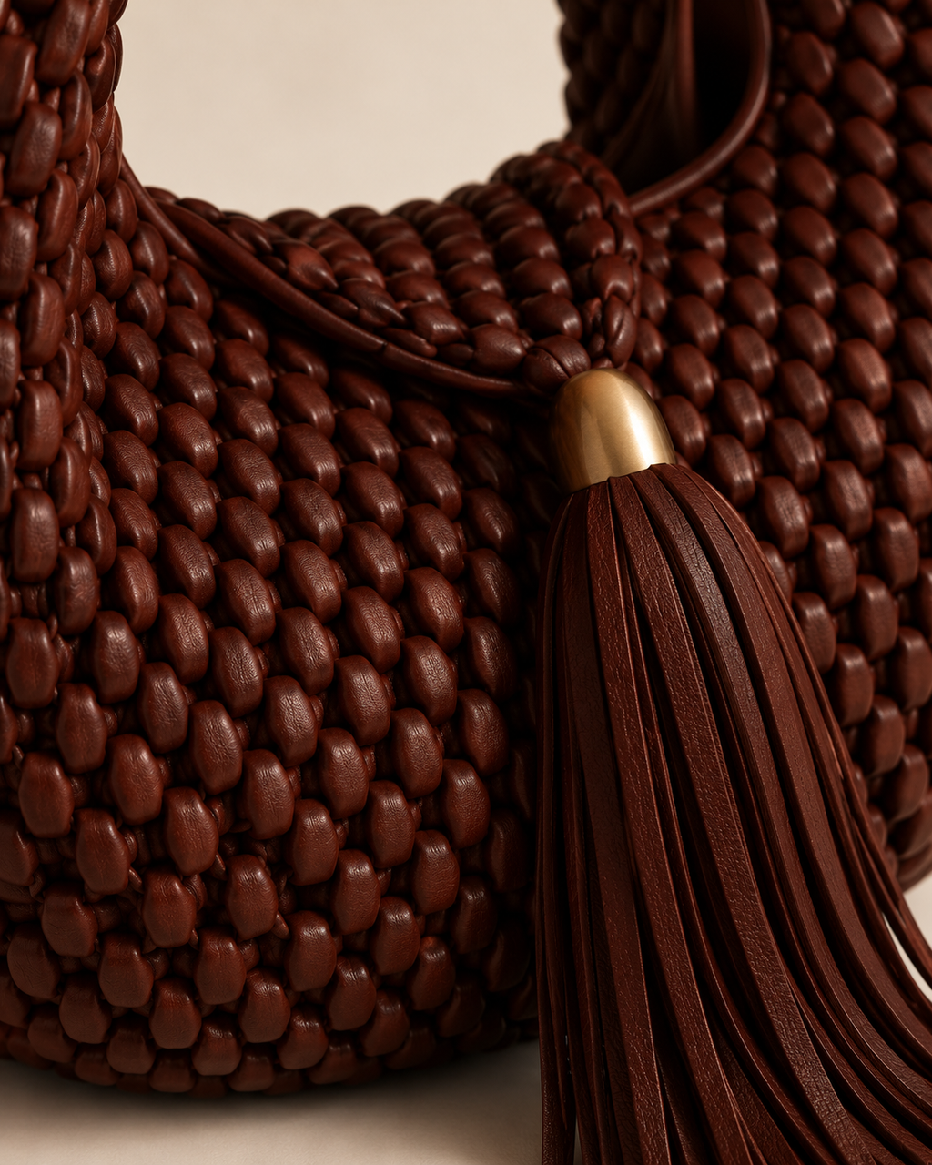 Luxury Woven Leather Hobo Bag with Statement Tassel and Gold Accent